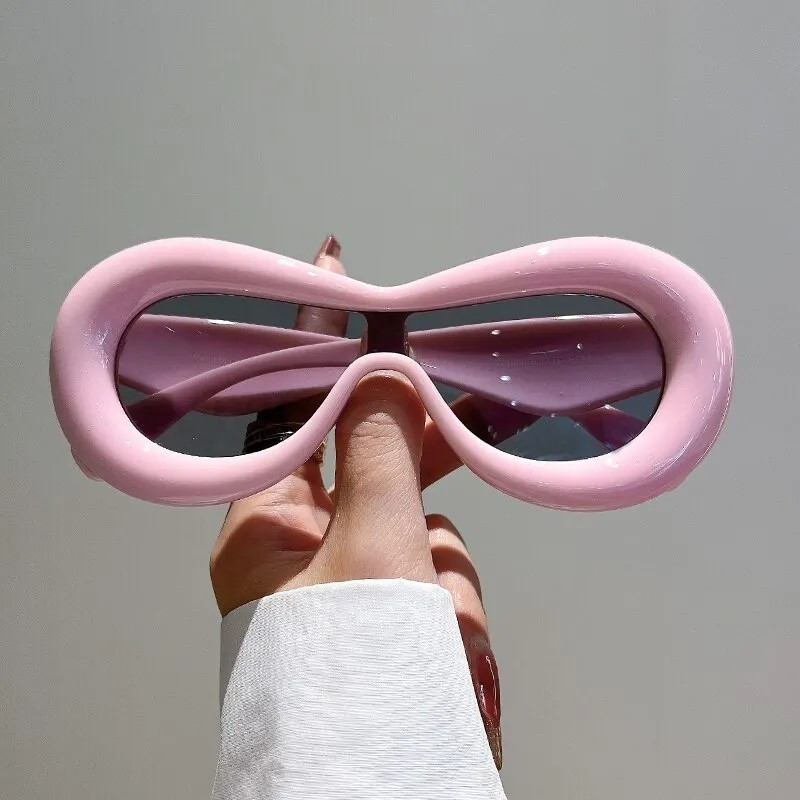 Рожеві сонцезахисні окуляри, захист від ультрафіолетових променів UV400. Оригінальні окуляри для креативних людей.