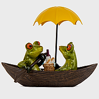 Фигурка декоративная Влюбленная пара лягушек на лодке 18х10х16 см 19124-007 *