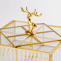 Ця унікальна скринька у формі прямокутника, виготовлена зі скла з металевим каркасом Золотого оленя,