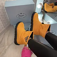 Оберіть стильні кросівки Prada Quilted Nylon Snow Boots Orange