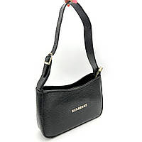 Женская кожаная сумочка черного цвета.
