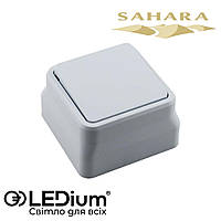 Выключатель одноклавишный накладной 10А SAHARA LEDium
