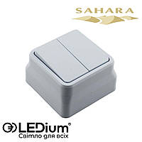 Выключатель двухклавишный накладной 10А SAHARA LEDium