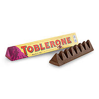 Шоколад молочний Toblerone з родзинками й нугою з меду та мигдалю, 100г