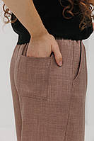 Жіночі штани темно-бежеві з кишенею ззаду