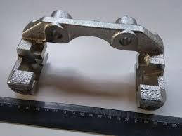 962737002 Скоба супорту Ланос переднього KS (з мастилом)