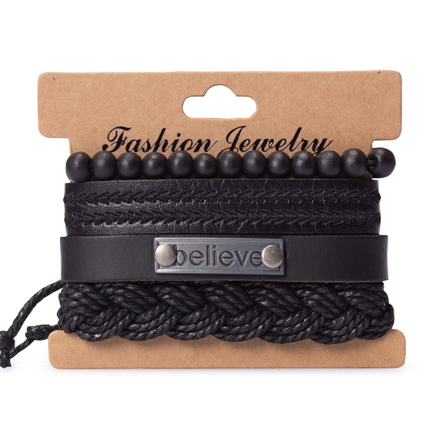 Набір з чотирьох браслетів на руку чорного кольору. Набір з чотирьох браслетів на руку чорного кольору.
