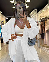 Белая женская свободная легкая рубашка из льна на пуговицах с нагрудными карманами и длинным рукавом