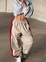 Стильные летние штаны свободного кроя на резинке со вставками с регулируемой длиной черные красные 42-46 Бежевый