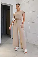 Літній жіночий костюм жатка бежевого кольору, широкі штани та блузка на резинці з коротким рукавом