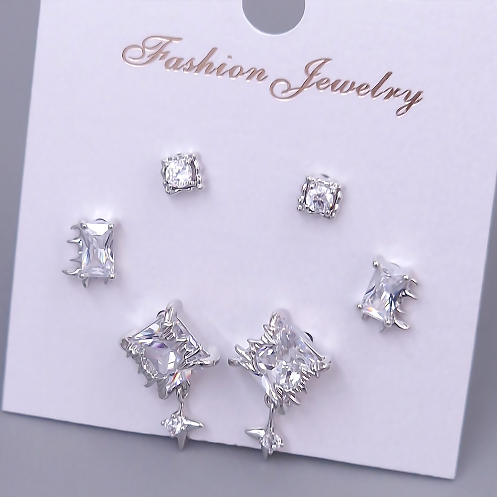 Набір із 3-х пар сережок-гвоздиків FJ. Родій. Камені: білий циркон