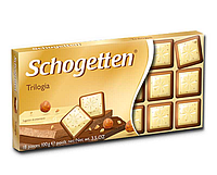 Молочно-білий шоколад з лісовим горіхом Schogеtten Trilogia, 100 г