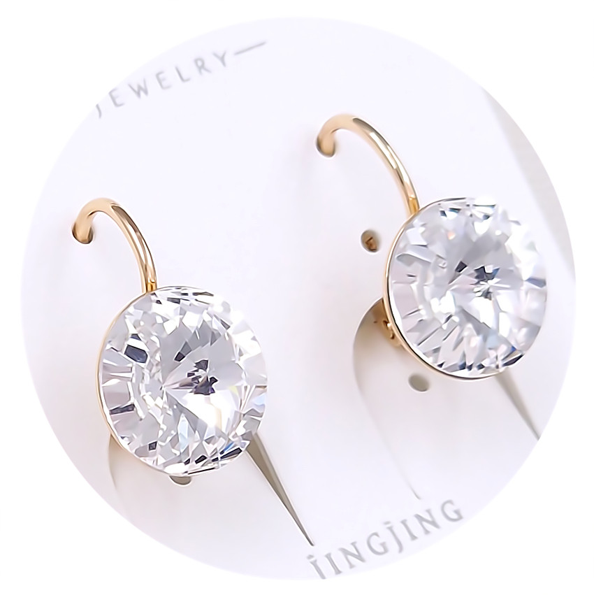 Сережки XР. Позолота 18К. Камені: Swarovski білого кольору. Довжина: 18 мм. Ширина: 11 мм.