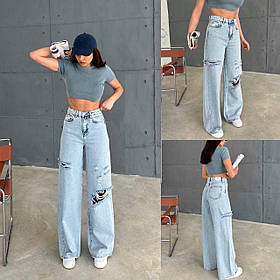 Жіночі вільного крою рвані джинси з високою посадкою