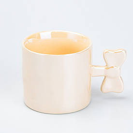 Чашка з ручкою у вигляді бантика керамічна 350 мл Жовта