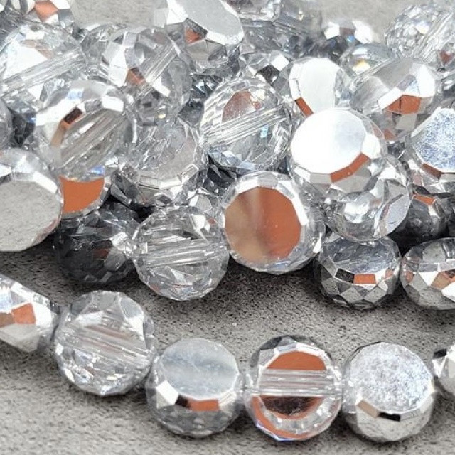 Бусины стекло монетка 9,5*5 мм цена указана за 15 штук,/ цвет прозрачный серебряный бок с АБ