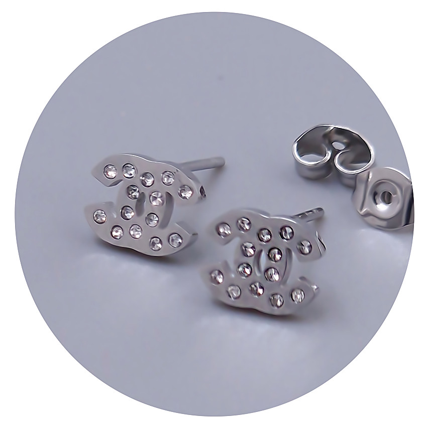 Сережки-гвоздики Stainless Steel. Сталь. Родій. Камені: циркон. Довжина: 6 мм. Ширина: 8 мм.