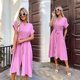 Рожеве літнє плаття міді на кулісці з американського крепу