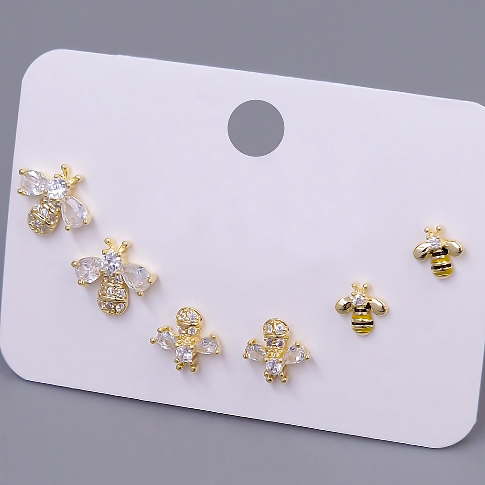 Набір із 3-х пар сережок-гвоздиків FJ. Позолота лимонного відтінку. Камені: циркон