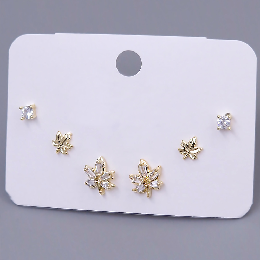 Набір із 3-х пар сережок-гвоздиків FJ. Позолота лимонного відтінку. Камені: циркон