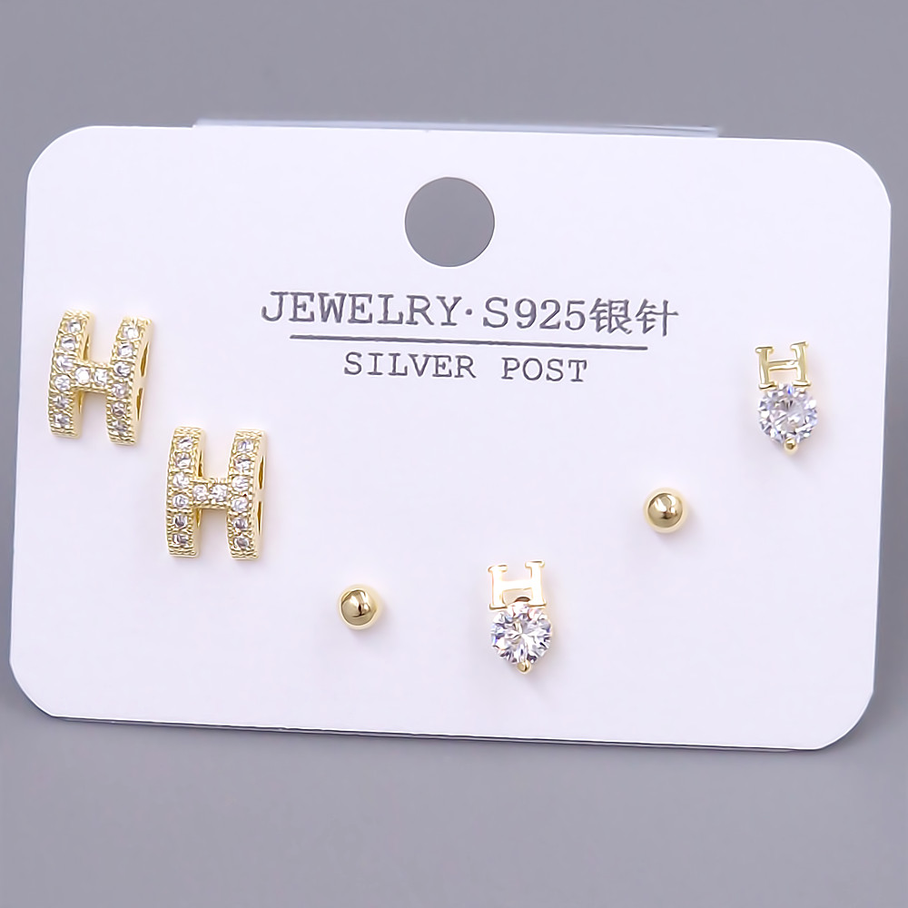 Набір із 3-х пар сережок-гвоздиків FJ. Позолота лимонного відтінку. Камені: циркон