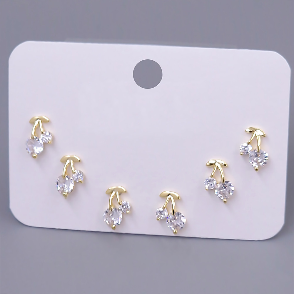 Набір із 3-х пар сережок-гвоздиків FJ. Позолота лимонного відтінку. Камені: циркон