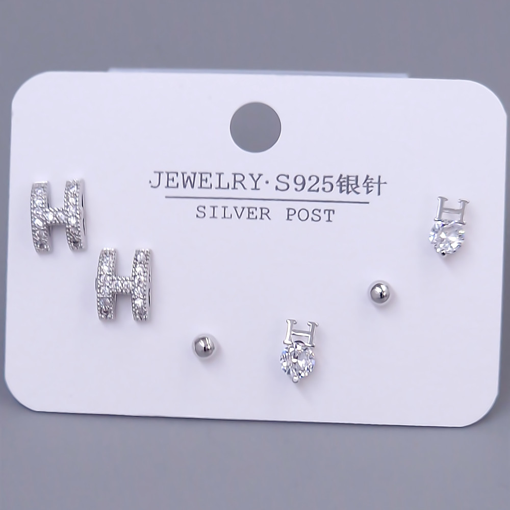 Набір із 3-х пар сережок-гвоздиків FJ. Родій. Камені: білий циркон