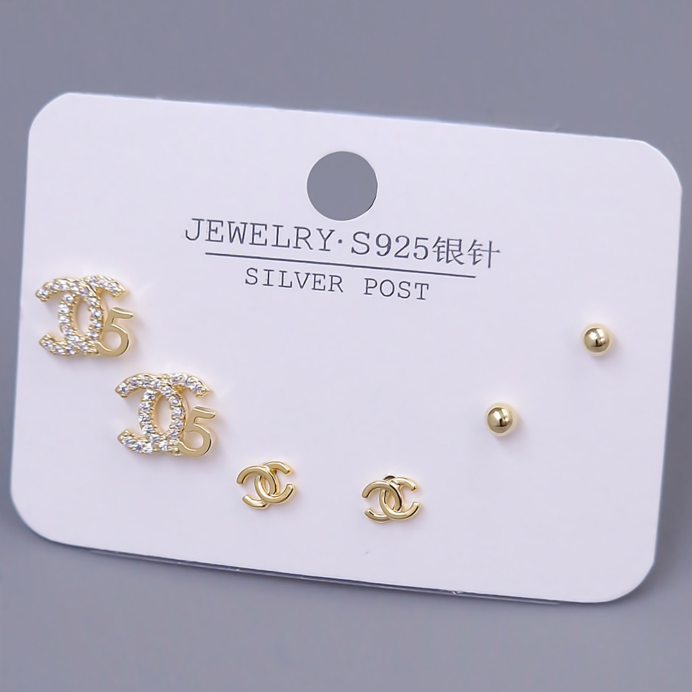 Набір із 3-х пар сережок-гвоздиків FJ. Позолота лимонного відтінку. Камені: циркон