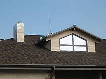 Облицовка травертином фасада частного дома 18