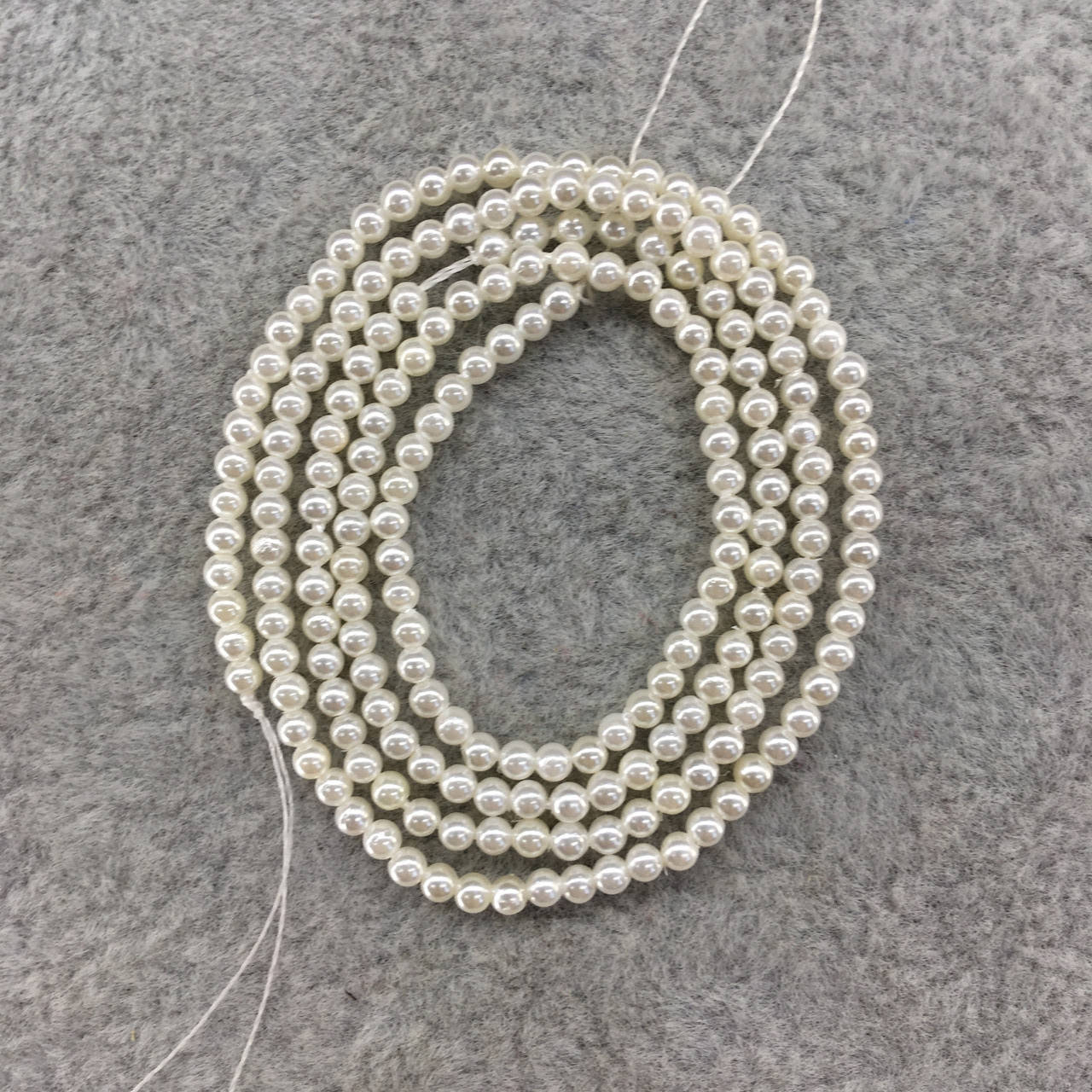 

Бусины на нитке Перламутр с покрытыем d-2.2мм (под жемчуг)