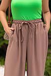 Жіночі штани палаццо літні широкі з жатки з резинкою на поясі (р. 42-52) 18121091, фото 3