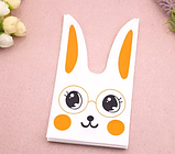 Пакети з малюнком Зайчик помаранчевий Велетні 36х21 см набір 10 шт подарункові дитячі з вушками зав'язками, фото 3