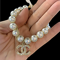 Сережки з логотипом в чорно-золотому кольорі з камінням, браслет з перлинами