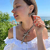 Сережки та підвіска з логотипом у чорно-золотому кольорі - бантики