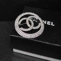 Брошка лого кругла /посріблення/ з камінням