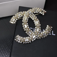 Брошка лого з камінням і перлами / посріблення