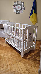 Дитяче ліжечко Лили Слоник з маятником, шухлядою та відкидною боковиною белая