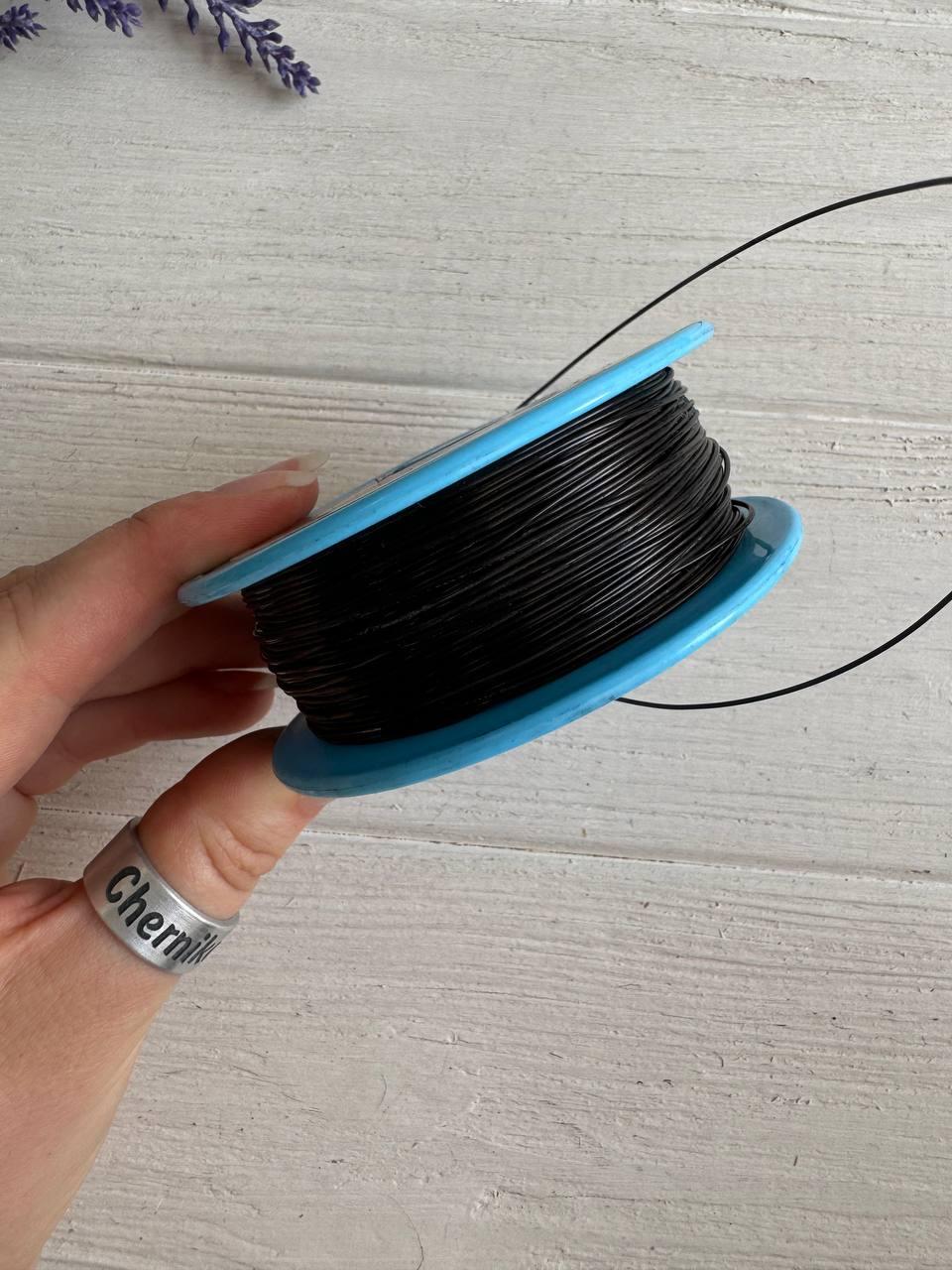 Волосінь ( мононитка)  " Marill "  0,7 мм , чорна  100 м  ( фарбує руки)