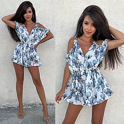 Жіночий комбінезон-ромпер в квітковий принт: низ шорти та вільний верх з вирізом та відкритими плечима