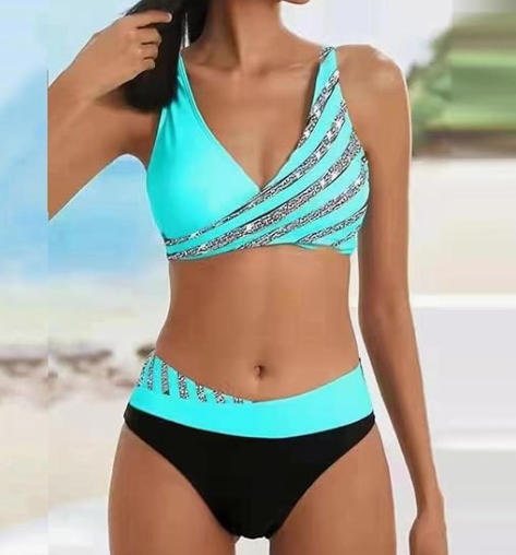 Жіночий роздільний купальник із високими трусиками у смужку бірюзового кольору.