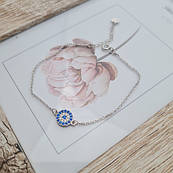 Срібний браслет з круглою підвіскою та білими і блакитними фіанітами