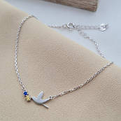 Срібний браслет з підвіскою пташкою та жовтим і блакитним фіанітами