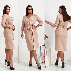 Неймовірно жіночна та елегантна сукня міді має V - образний виріз, накладні кишені.