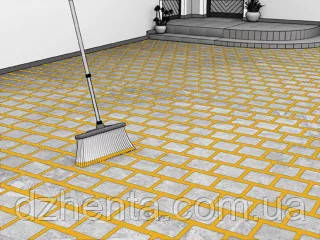 Заповнення швів бруківки