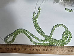 Нимистини салатовий бите скло діаметр 6 мм на нитці