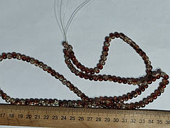 Нимистини бите скло коричньовий діаметр 6 мм на нитці