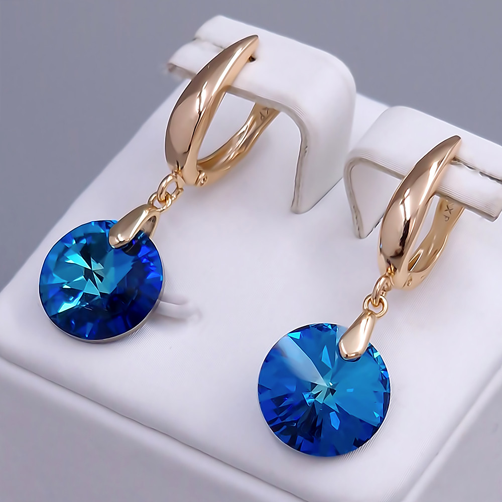 Сережки XР. Позолота 18К. Камені: Swarovski синього кольору. Довжина: 36 мм. Ширина: 12 мм