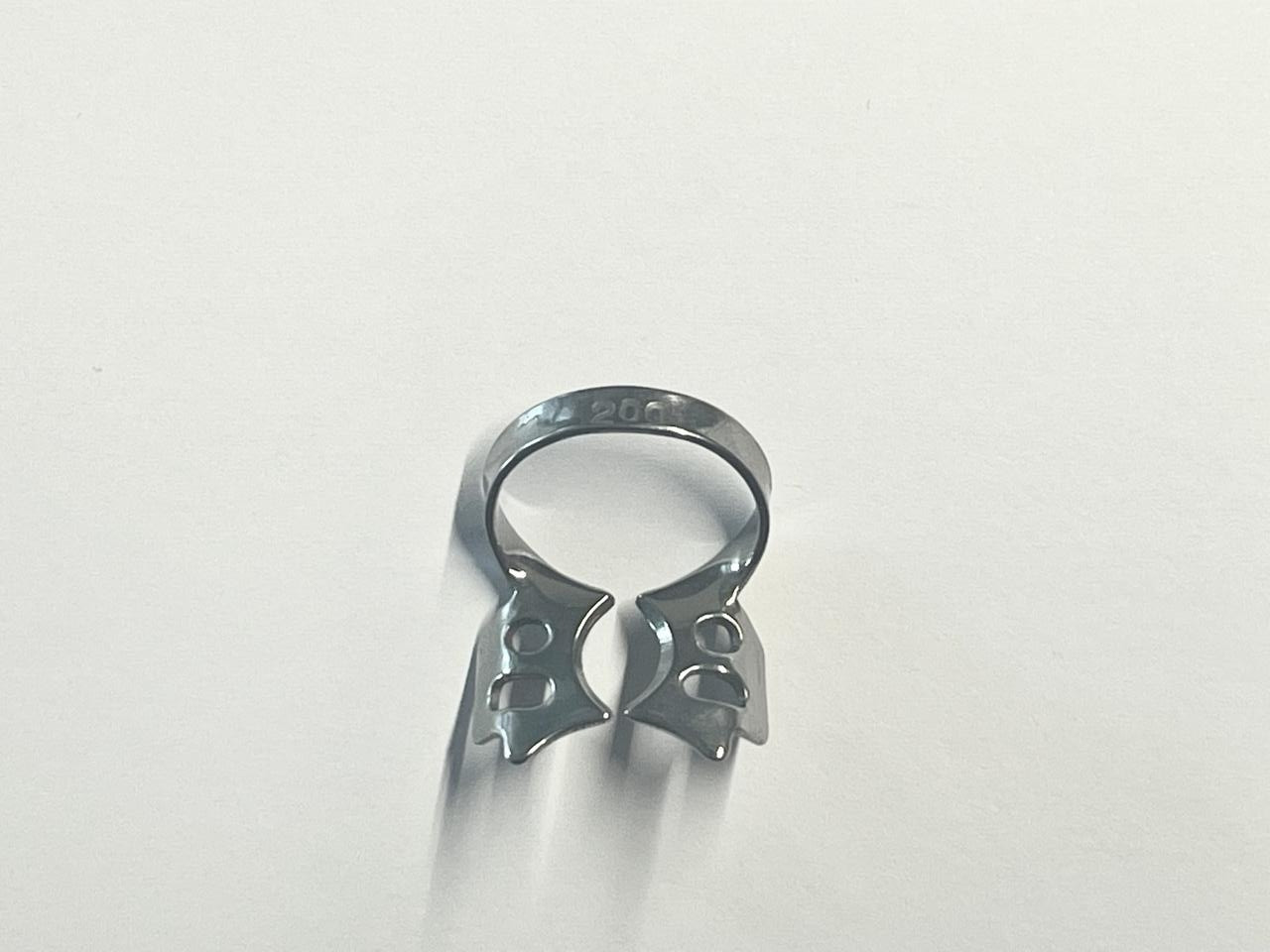 Кламмер (кламп) для нижніх молярів з "крилами", Пакистан