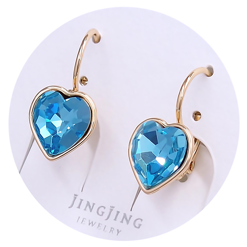 Сережки XР. Позолота 18К. Камені: Swarovski бірюзового кольору. Довжина: 19 мм. Ширина: 10 мм.