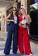 Жіночий костюм темно-синього кольору штани з кишенями та подовжений жилет без рукава